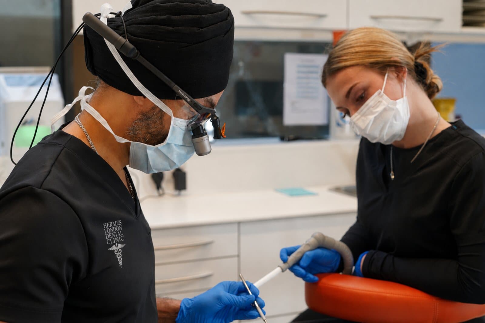 Dentist and dental nurse working together at Hermes London Dental Clinic