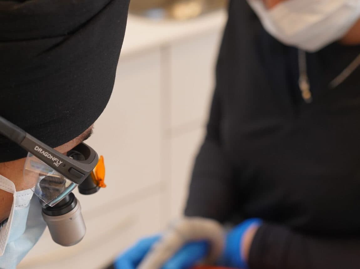 A dentist working with implant instruments at Hermes London Dental Clinic